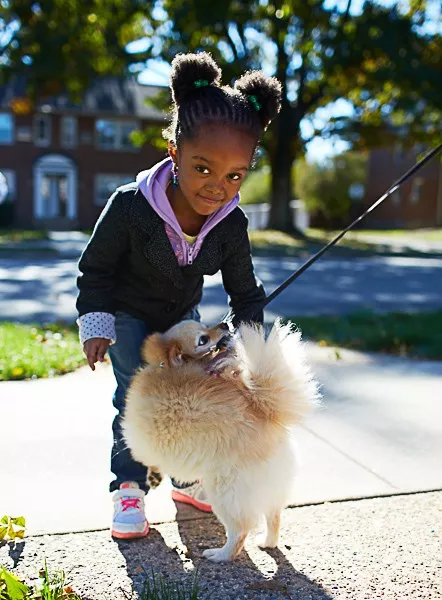 girl petting dog in lynnewood gardens