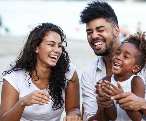 family at beach mobile