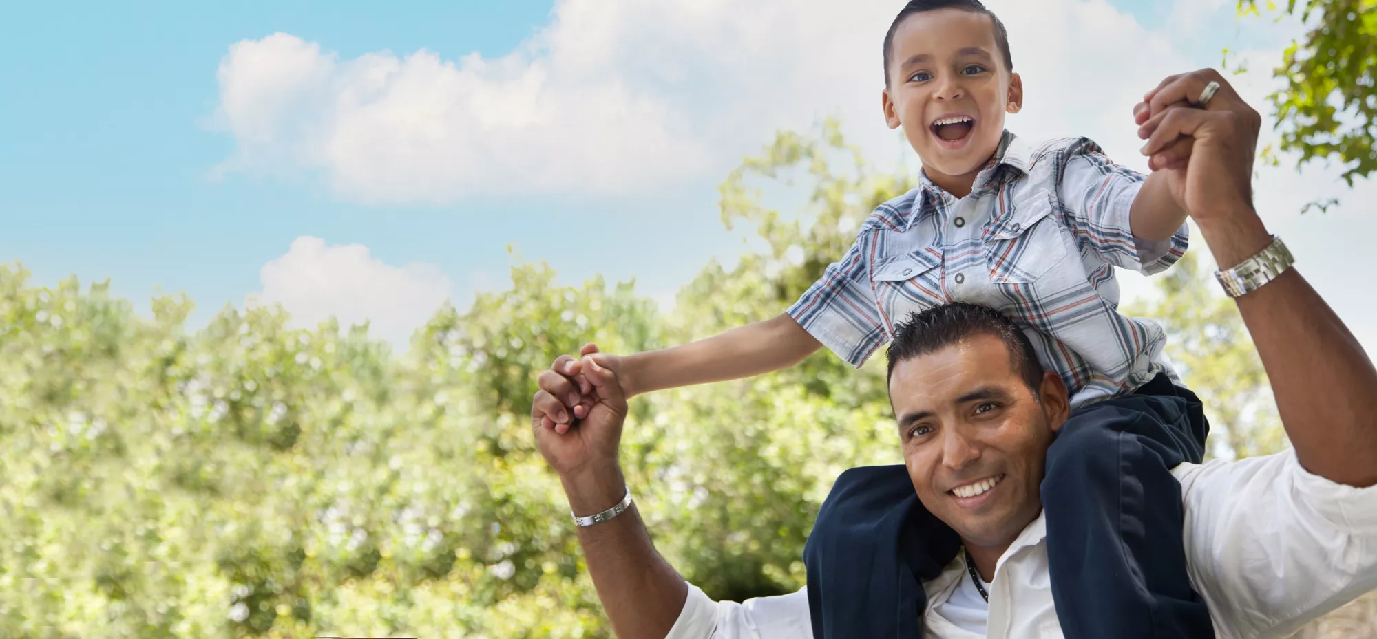 Father holding son on shoulder